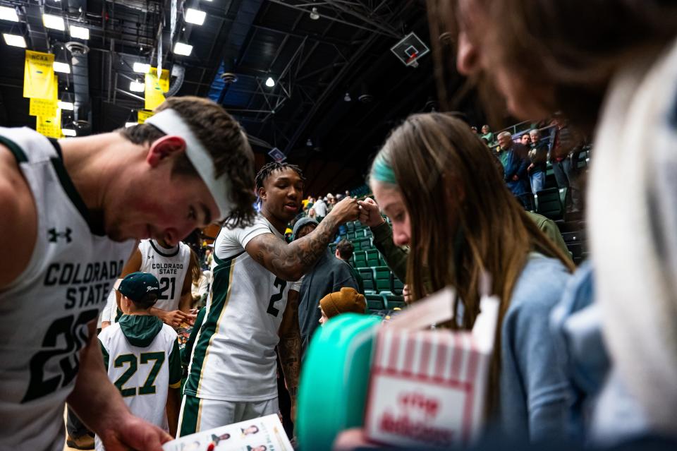 Colorado State University's Taviontae Jackson (2) celebrates with fans after their game against Air Force at Moby Arena on Tuesday. CSU won 78-69 in overtime.