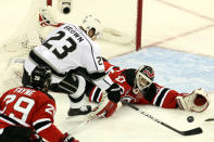 NEWARK, NJ - JUNE 09: Martin Brodeur #30 of the New Jersey Devils tries to make a save against Dustin Brown #23 of the Los Angeles Kings during Game Five of the 2012 NHL Stanley Cup Final at the Prudential Center on June 9, 2012 in Newark, New Jersey. (Photo by Jim McIsaac/Getty Images)