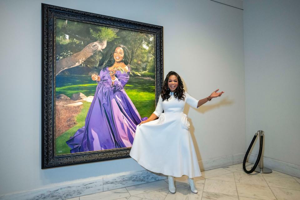 Oprah Winfrey stands next to her newly installed portrait in the Smithsonian's National Portrait Gallery, Wednesday, Dec. 13, 2023, during a portrait unveiling ceremony in Washington.