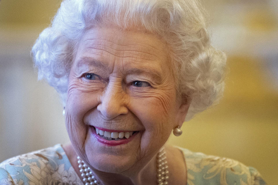 Britain's Queen Elizabeth II smiles as she talks with trustees and staff from The Queen's Trust during a reception in Buckingham Palace, London on October 17, 2019, to mark the work of The Queen's Trust. - The Queens Trust began as The Silver Jubilee Appeal Fund in 1977, with the aim of helping young people to help others. The Queens Commonwealth Trust, will continue the legacy of the Trusts work going forward. (Photo by Victoria Jones / POOL / AFP) (Photo by VICTORIA JONES/POOL/AFP via Getty Images)