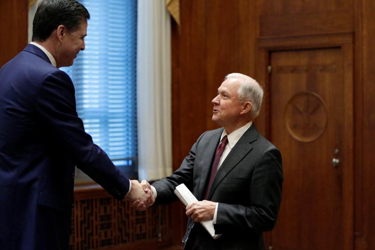 Attorney General Jeff Sessions (R) shakes hands with FBI Director James Comey before his first meeting with heads of federal law enforcement components at the Justice Department in Washington, U.S., February 9, 2017.&nbsp; (Photo: Yuri Gripas / Reuters)