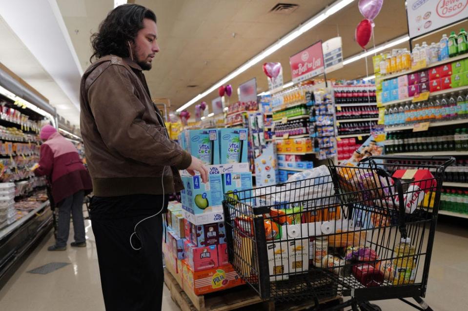 Customers shop at a grocery store on February 13, 2024 in Chicago, Illinois.