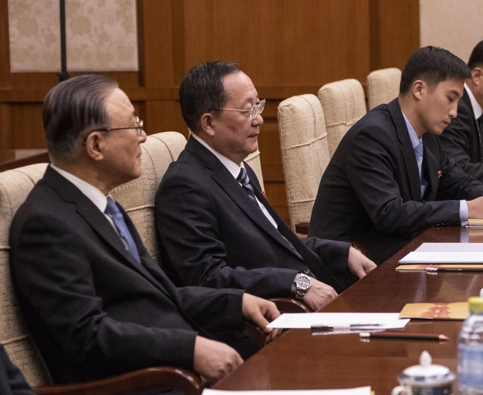 North Korean Foreign Minister Ri Yong Ho, center, listens to China's Foreign Minister Wang Yi during a meeting at the Diaoyutai State Guesthouse in Beijing Friday, Dec. 7, 2018. (Fred Dufour/Pool Photo via AP)