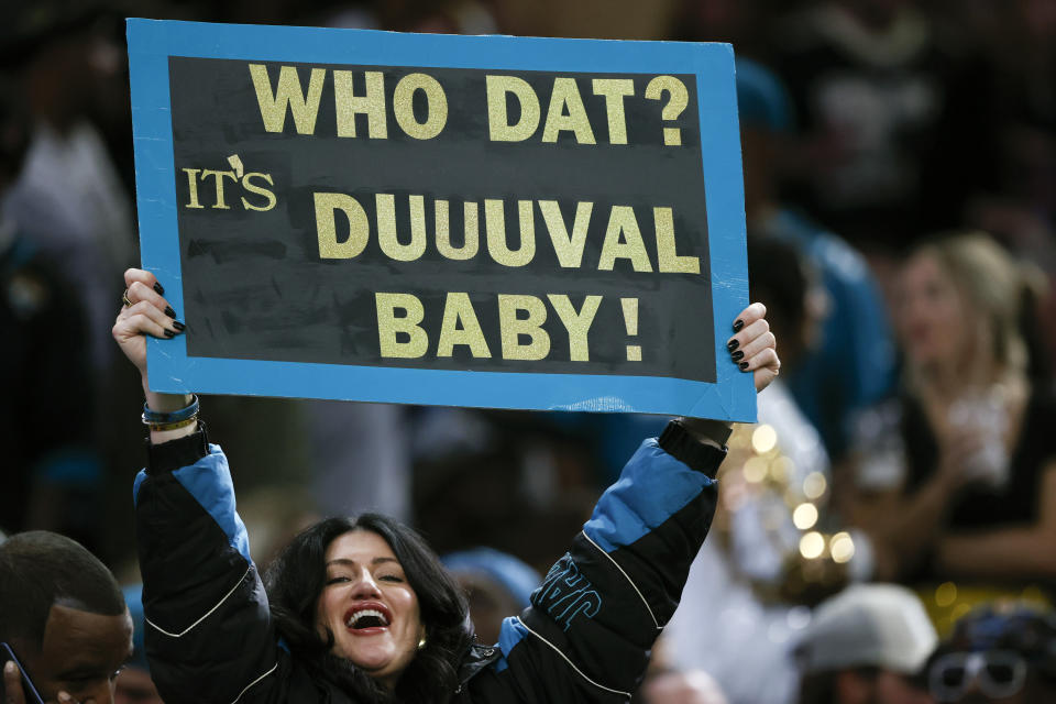 A Jacksonville Jaguars fan holds up a sign referring to Duval County, Fla. home of the Jaguars in the first half of an NFL football game between the New Orleans Saints and the Jacksonville Jaguars in New Orleans, Thursday, Oct. 19, 2023. (AP Photo/Butch Dill)