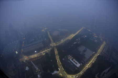 A view of the Singapore F1 Grand Prix night race Marina Bay street circuit shrouded by haze in Singapore September 14, 2015. REUTERS/Edgar Su/File Photo