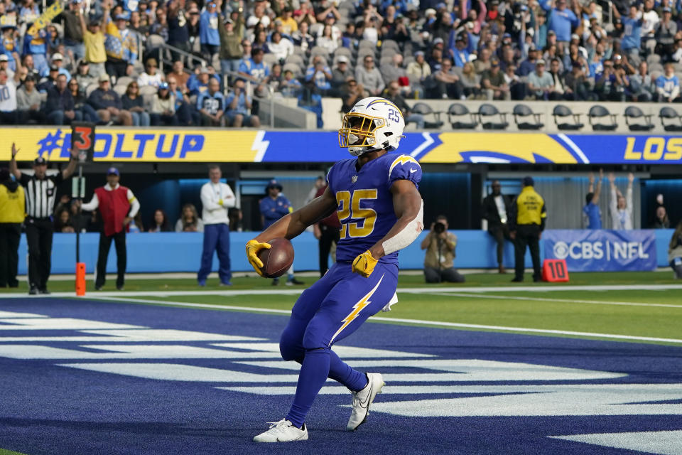 Los Angeles Chargers running back Joshua Kelley (25) celebrates after scoring against the Tennessee Titans during the first half of an NFL football game in Inglewood, Calif., Sunday, Dec. 18, 2022. (AP Photo/Marcio Jose Sanchez)