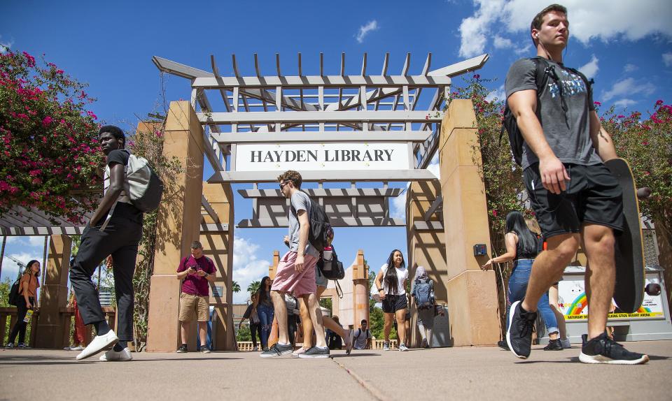 Students walk between classes on the Tempe campus of Arizona State University on Sept. 11, 2019.