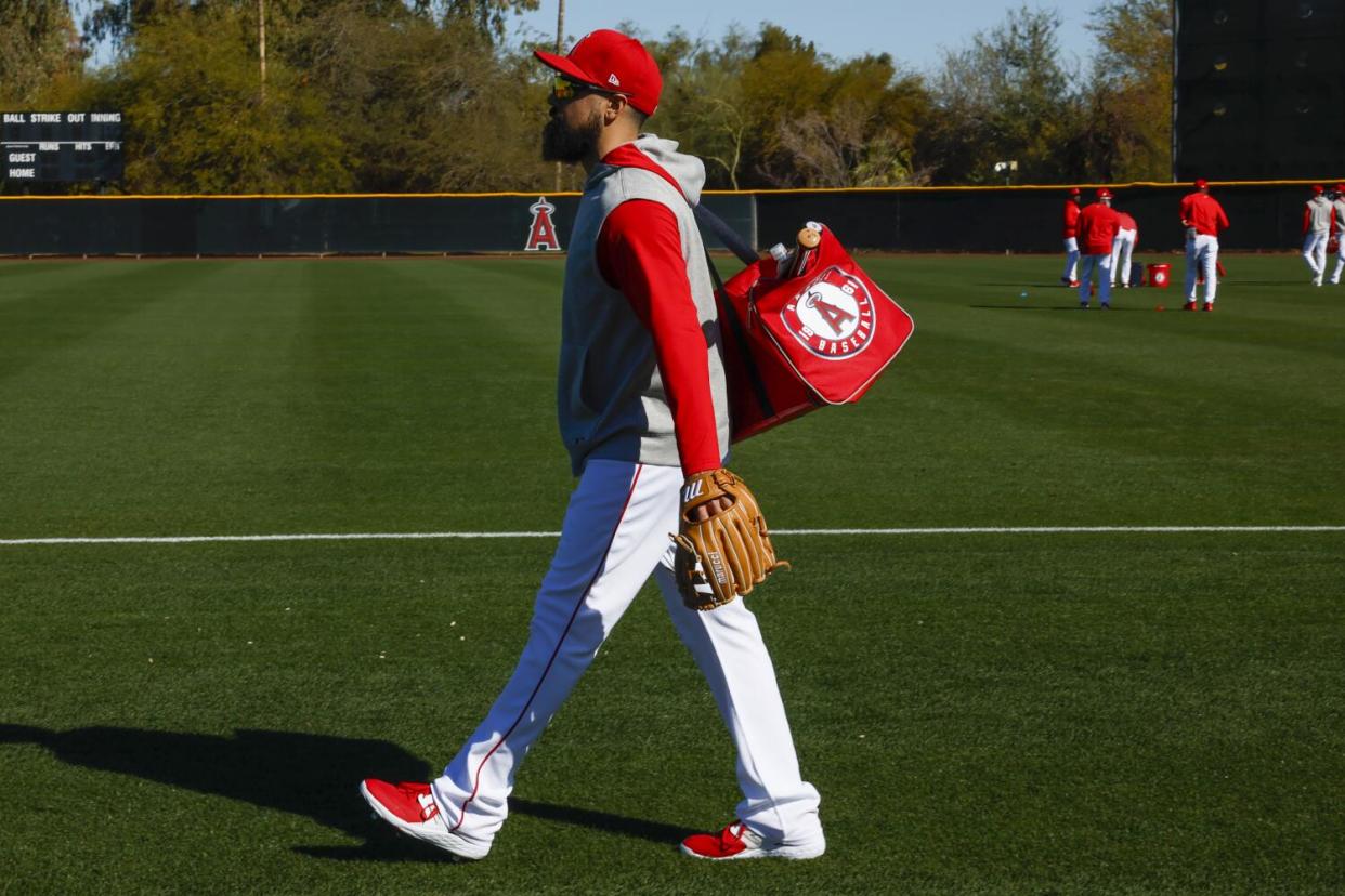 Angels third baseman Anthony Rendon walks on the field at Tempe Diablo Stadium during spring training on Feb. 19.