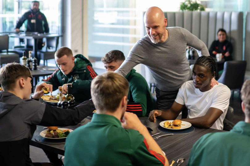 Erik ten Hag congratulates members of United's victorious Under-18s team. -Credit:Manchester United