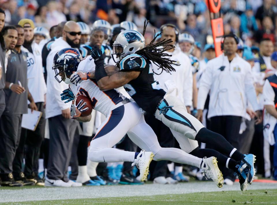 Tre Boston rides the Denver Broncos' Andre Caldwell out of bounds during the first half of Super Bowl 50.