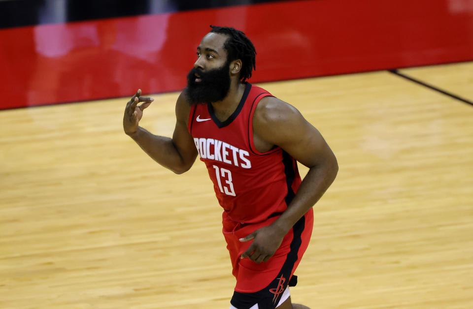 Jan 10, 2021; Houston, Texas, USA; James Harden #13 of the Houston Rockets reacts to a basket during the first quarter of a game against the Los Angeles Lakers at Toyota Center on January 10, 2021 in Houston, Texas. 