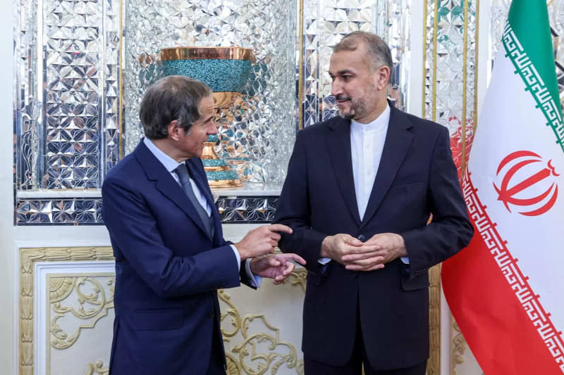 Iranian Foreign Minister Hossein Amir-Abdollahian (R) welcomes International Atomic Energy Agency (IAEA) Director General Rafael Mariano Grossi (L) before their meeting in Tehran. Iranian Foreign Ministry/ZUMA Press Wire/dpa