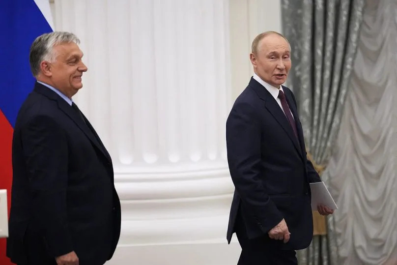 Russian President Vladimir Putin, right, and Hungarian Prime Minister Viktor Orban leave a hall after a joint news conference following their talks in the Kremlin, 5 July 2024