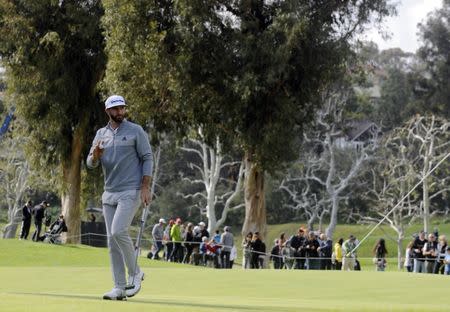 February 19, 2017; Pacific Palisades, CA, USA; Dustin Johnson reacts after making his putt on the seventh hole green during the final round of the Genesis Open golf tournament at Riviera Country Club. Mandatory Credit: Gary A. Vasquez-USA TODAY Sports