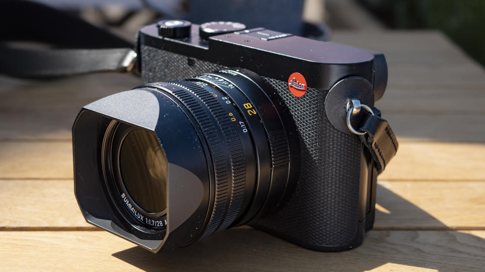 Leica Q3 camera on a wooden table