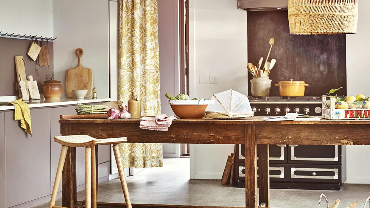  kitchen with wooden table and cutting boards 