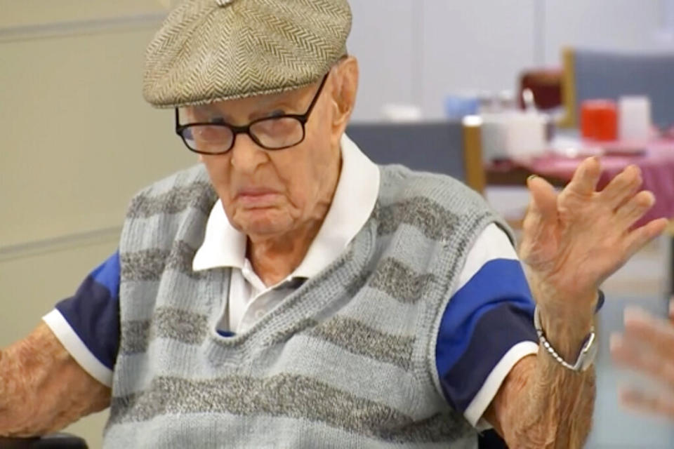 Australia's Dexter Kruger gestures at a nursing home in the rural Queensland state town of Roma, Australia on May 13, 2021.  Kruger, Australiaâs oldest-ever man, has included eating chicken brains among his secrets to living more than 111 years. The retired cattle rancher on Monday, May 17, 2021, marked 124 days since he turned 111, a day older than World War I veteran Jack Lockett was when he died in 2002. (Australian Broadcasting Corporation via AP) (Photo:  via AP)