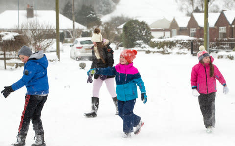 Children have a snowball fight in Yeadon, Yorkshire, on Thursday