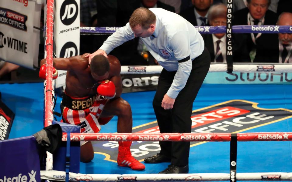 kell Brook kneels down as his left eye closes - Credit: Reuters