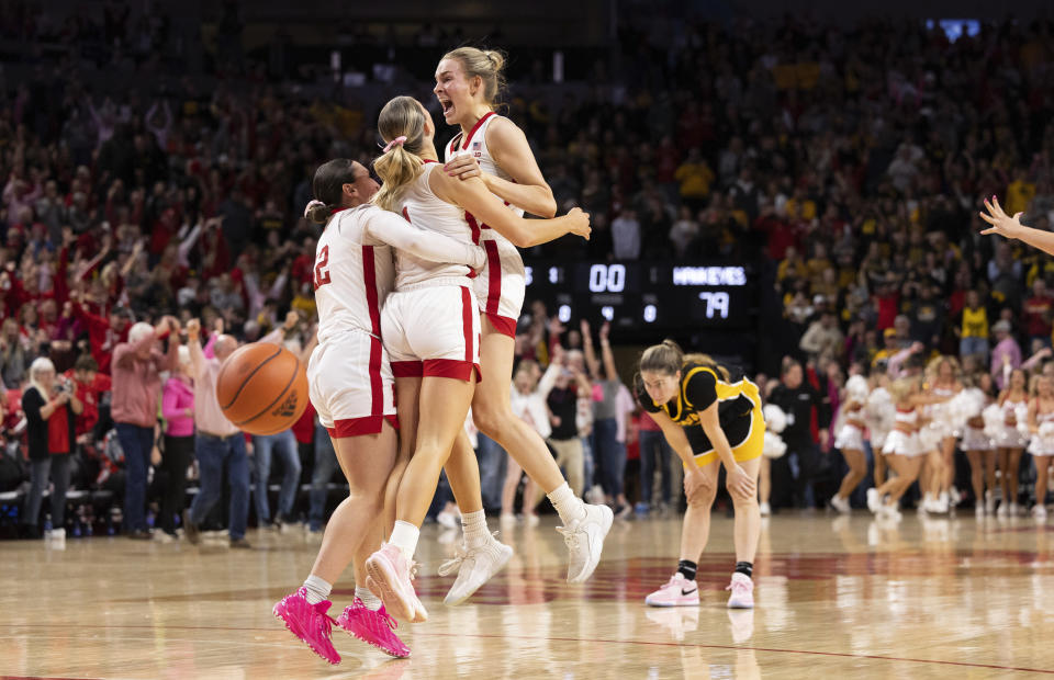 From left to right, Nebraska's Maddie Krull, Jaz Shelley and Natalie Potts celebrate after their win over Iowa in an NCAA college basketball game Sunday, Feb. 11, 2024, in Lincoln, Neb. (AP Photo/Rebecca S. Gratz)