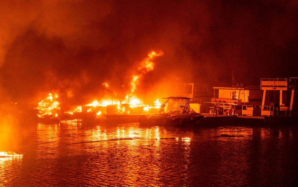 Docked boats burn on Lake Berryessa during the LNU Lightning Complex Fire in Napa, Calif., on Aug. 19.