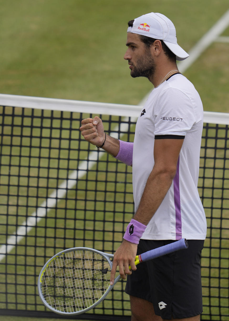 Matteo Berrettini of Italy celebrates winning at match point against Andy Murray of Britain during their singles tennis match at the Queen's Club tournament in London, Thursday, June 17, 2021. (AP Photo/Kirsty Wigglesworth)