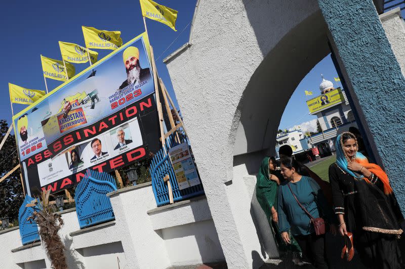 A sign outside the Guru Nanak Sikh Gurdwara temple is seen after the killing on its grounds in June 2023 of Sikh leader Hardeep Singh Nijjar, in Surrey