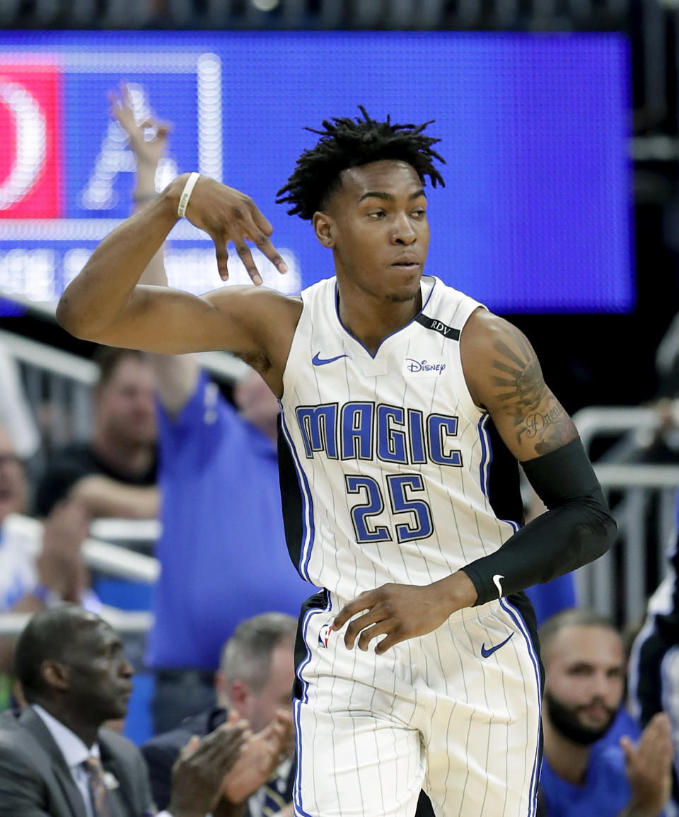 Orlando Magic's Wes Iwundu gestures after sinking a three-point basket against the Toronto Raptors during the first half in Game 3 of a first-round NBA basketball playoff series, Friday, April 19, 2019, in Orlando, Fla. (AP Photo/John Raoux)