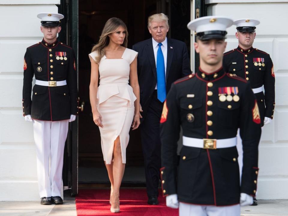 <p>The first lady stepped out to greet the South Korean President in a rose pink peplum dress by Roland Mouret, nude Louboutin pumps, and minimal jewelry.</p>