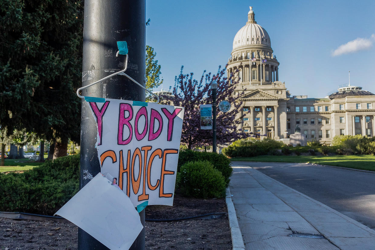 A sign reading "MY BODY MY CHOICE," is taped to a streetlight in front of the Idaho State Capitol in Boise, Idaho, on May 3, 2022.