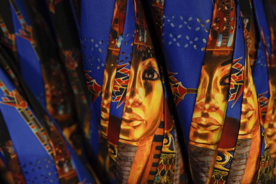 King Tut umbrellas on appear at the Beyond King Tut Immersive Experience gift shop, Thursday, Oct. 27, 2022, in New York. The exhibition will open to the public on Friday, in commemoration of the the 100th anniversary of the discovery of King Tut's tomb on Nov. 4, 1922. (AP Photo/Julia Nikhinson)