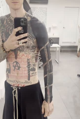 <p>Instagram/machinegunkelly</p> Machine Gun Kelly's blackout tattoo in process