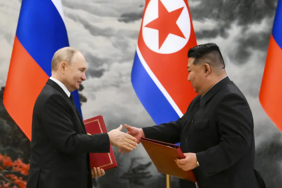 Russian President Vladimir Putin, left, and North Korea's leader Kim Jong Un exchange documents during a signing ceremony of the new partnership in Pyongyang, North Korea, on Wednesday, June 19, 2024. Putin and Kim signed a new partnership that includes a vow of mutual aid if either country is attacked, during a Wednesday summit that came as both face escalating standoffs with the West. (Kristina Kormilitsyna, Sputnik, Kremlin Pool Photo via AP)