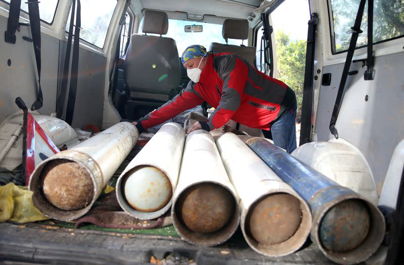 Miralem Sabic unloads oxygen bottles from his private van in front of an improvised coronavirus disease (COVID-19) hospital in Konjic, Bosnia and Herzegovina