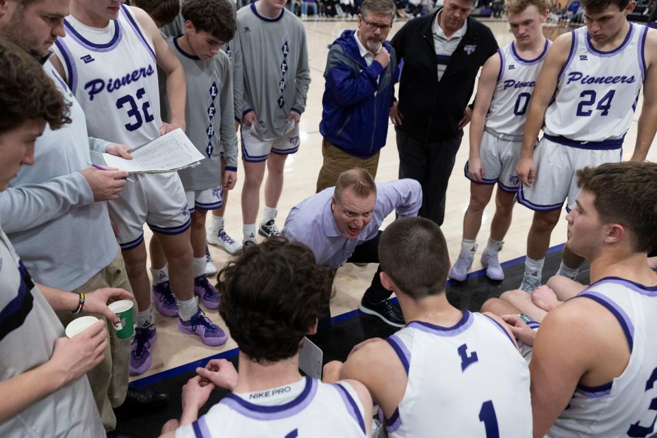 Coach Quincy Lewis leads the last huddle during a game against Pleasant Grove at Lehi High School in Lehi on Friday, Jan. 26, 2024. Lehi won 77-61. | Marielle Scott, Deseret News