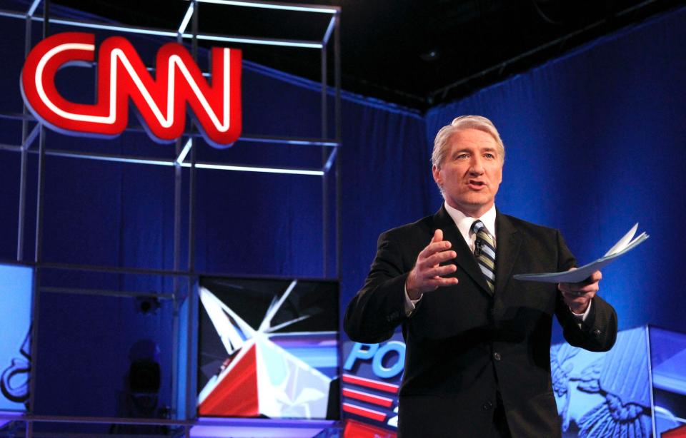 2012 file photo shows moderator and CNN correspondent John King speaks to a crowd before a debate.