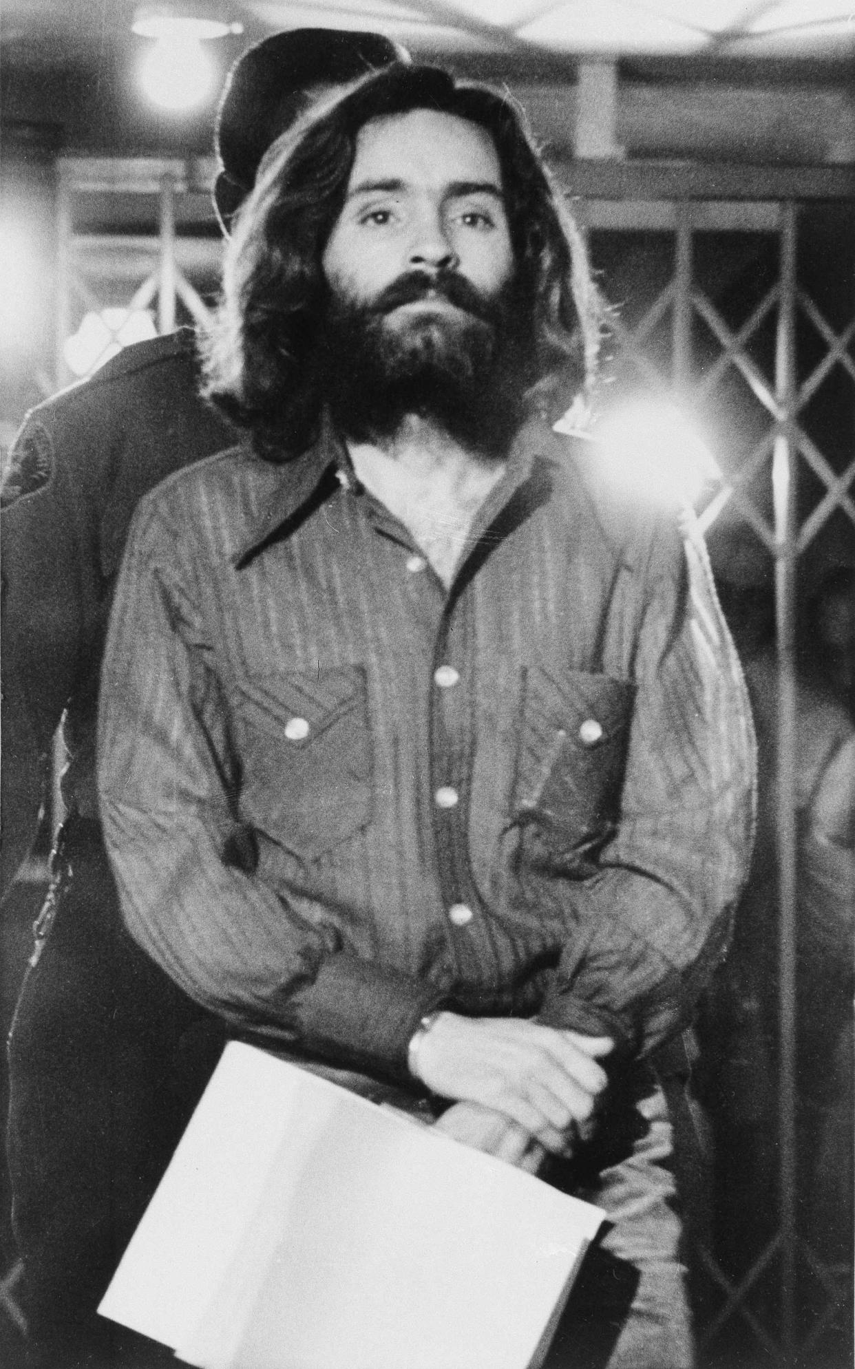 Charles Manson leaves a Los Angeles courtroom after telling a judge “lies have been told” about him, on Dec. 22, 1969. (AP Photo/Wally Fong)