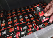 This Wednesday, Aug. 28, 2019, photo shows a bin of Kingpen packaging sold at a wholesale vape shop in downtown Los Angeles. Bootleggers eager to profit off unsuspecting consumers are mimicking popular vape brands, pairing replica packaging churned out in Chinese factories with untested, and possibly adulterated, cannabis oil produced in the state's vast underground market. (AP Photo/Richard Vogel)