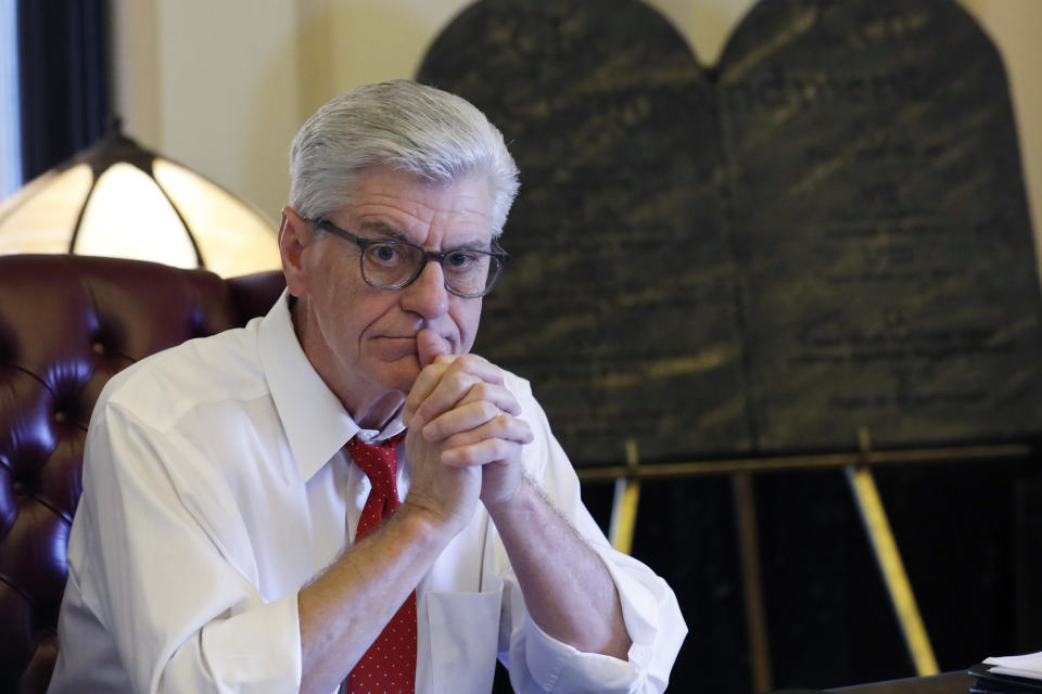 FILE - During his final week in office, Mississippi Republican Gov. Phil Bryant ponders a question in the state Capitol in Jackson, Miss., on, Jan. 8, 2020. Nancy New, who was convicted in 2022 in a welfare misspending case, said in a court filing Feb. 26, 2024, that Bryant told people in 2019, during his final weeks of office, that he had been offered a financial stake in a company that had received welfare money for its effort to develop a concussion drug. (AP Photo/Rogelio V. Solis, File)