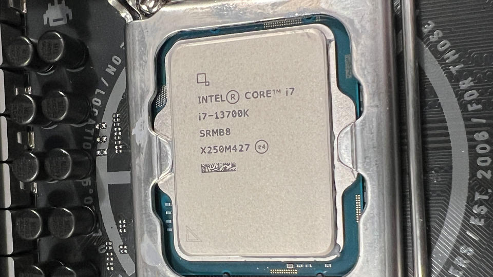 An Intel Core i7-13700K inserted into a motherboard