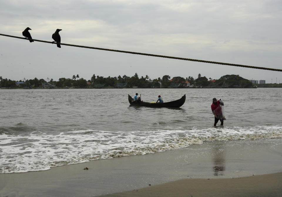 A fisherman brings in his catch from the Arabian Sea during the Coronavirus pandemic in Kochi, Kerala state, India, Friday, May 29, 2020. India’s economic growth will fall to 4.2% in financial year 2019-20 as compared to 6.1% in the previous year and likely to contract this year because of the coronavirus pandemic. Millions of workers have fled cities after losing their jobs as authorities imposed the lockdown in March and started easing it early this month to promote economic activity. (AP Photo/R S Iyer)