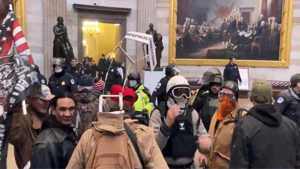 Jorge Riley is seen in the bottom left corner of an image taken from U.S. Capitol Police video inside Statuary Hall on Jan. 6, 2021. Riley, an Army veteran who was seen participating in the Jan. 6 insurrection on the U.S. Capitol, is expected to be sentenced in court Wednesday.