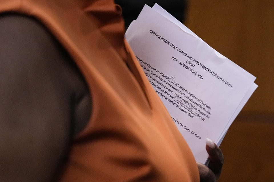 County Clerk Che Alexander departs the courtroom of Fulton County Superior Court Judge Robert McBurney, Monday, Aug. 14, 2023, in Atlanta. (AP Photo/Brynn Anderson)