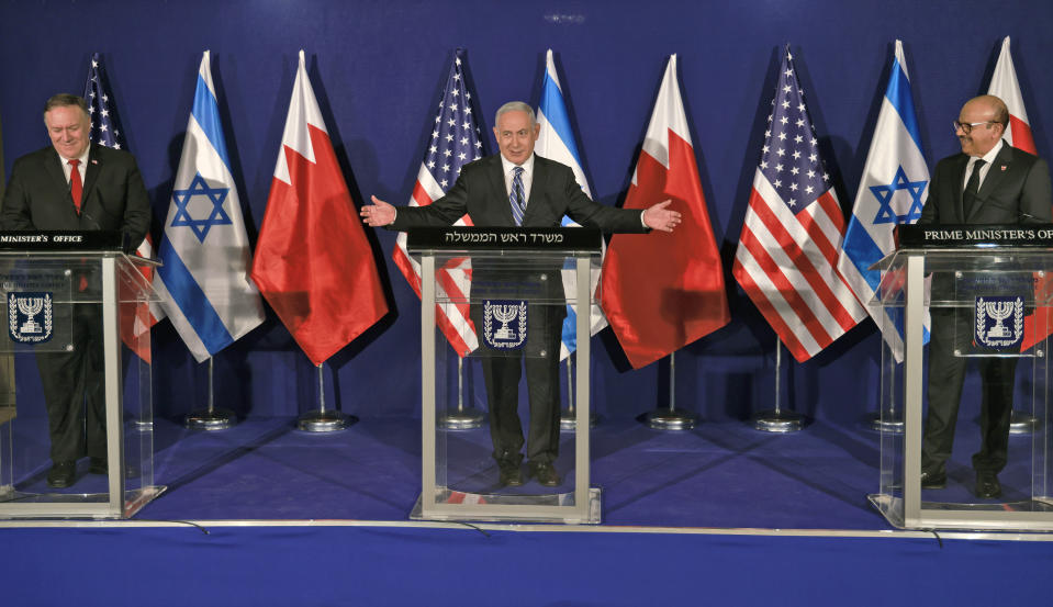 From left to right, U.S. Secretary of State Mike Pompeo, Israeli Prime Minister Benjamin Netanyahu and Bahrain's Foreign Minister Abdullatif bin Rashid Alzayani hold a joint press conference after their trilateral meeting in Jerusalem on Wednesday, Nov. 18, 2020. (Menahem Kahana/Pool via AP)