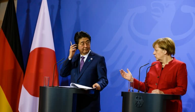 German Chancellor Angela Merkel and Japanese Prime Minister Shinzo Abe hold a press conference after bilateral talks in Gransee on May 4, 2016