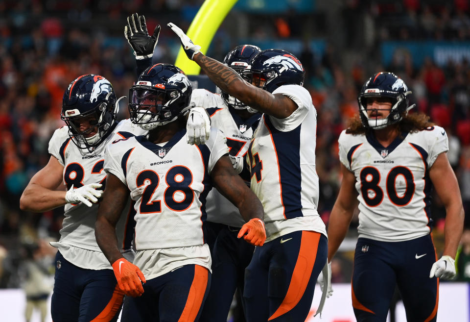 LONDON, ENGLAND - OCTOBER 30: Latavius Murray #28 of the Denver Broncos celebrates with teammates after scoring a touchdown during the fourth quarter in the NFL match between Denver Broncos and Jacksonville Jaguars at Wembley Stadium on October 30, 2022 in London, England. (Photo by Dan Mullan/Getty Images)