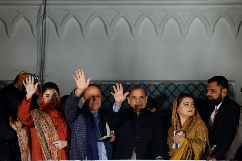 Supporters of Former Prime Minister of Pakistan Nawaz Sharif cheer as they gather at the party office of Pakistan Muslim League (N) at Model Town in Lahore