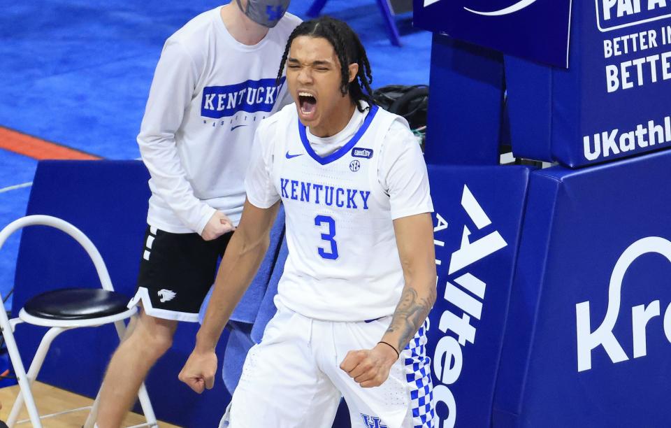 B.J. Boston yells and celebrates during a Kentucky basketball game.