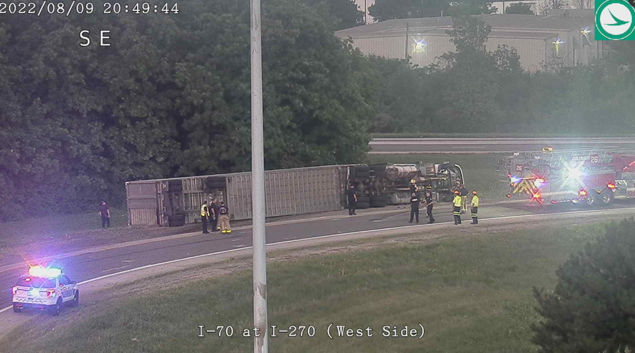 A trailer truck carrying 32 cattle overturned onto the driver's side Tuesday night while traveling on the I-70E ramp to I-270N, as seen here in this still photograph captured from an Ohio Department of Transportation camera.