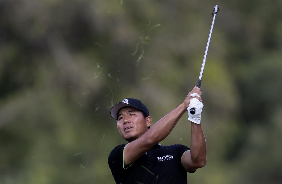 China's Ashun Wu plays a shot on the 18th hole during the third round of the Dubai Desert Classic golf tournament in Dubai, United Arab Emirates, Saturday, Jan. 25, 2020. (AP Photo/Kamran Jebreili)